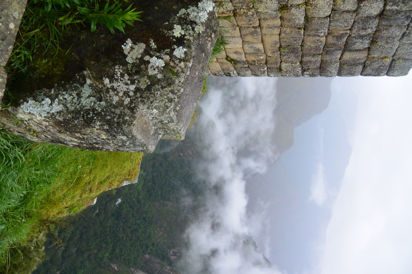 Machu Picchu clouds and stone wall